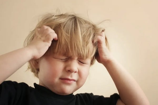 What are the symptoms of headaches in children